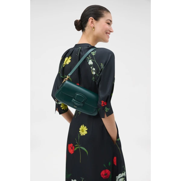 Profile view of model wearing the Oroton CARTER BAGUETTE in IVY and Premium saffiano leather for Women