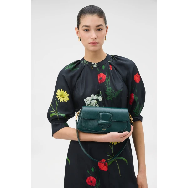 Profile view of model wearing the Oroton CARTER BAGUETTE in IVY and Premium saffiano leather for Women