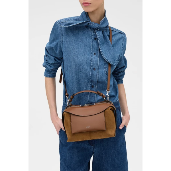Profile view of model wearing the Oroton MICA BOWLER SUEDE in TEAK and Premium suede leather for Women