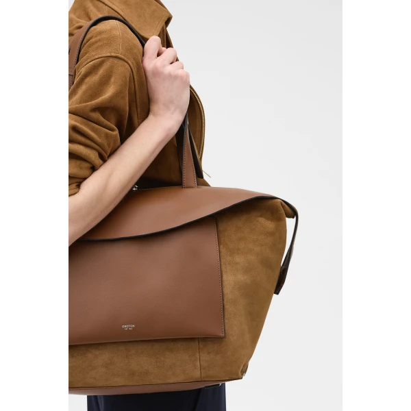 Profile view of model wearing the Oroton MICA MEDIUM TOTE SUEDE in TEAK and Premium suede leather for Women