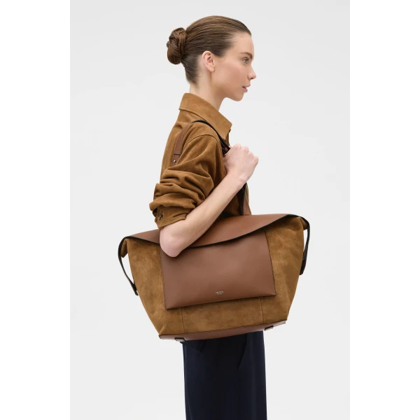 Profile view of model wearing the Oroton MICA MEDIUM TOTE SUEDE in TEAK and Premium suede leather for Women