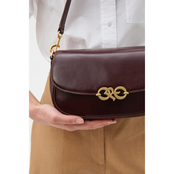 Profile view of model wearing the Oroton OLIVIA DAY BAG in COPPER and Premium crackle leather for Women