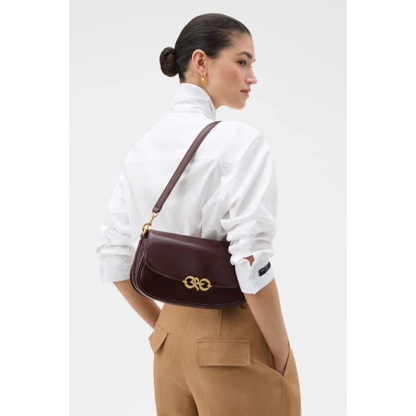 Profile view of model wearing the Oroton OLIVIA DAY BAG in COPPER and Premium crackle leather for Women