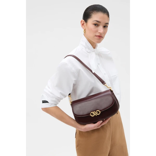 Profile view of model wearing the Oroton OLIVIA DAY BAG in COPPER and Premium crackle leather for Women