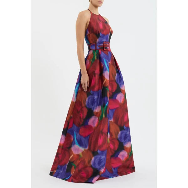 complemented by an open back and neck tie for a touch of allure. Cinched at the waist with a self-belt