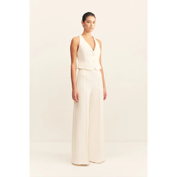 High waisted pant with a wide flare in a textured crepe fabrication.