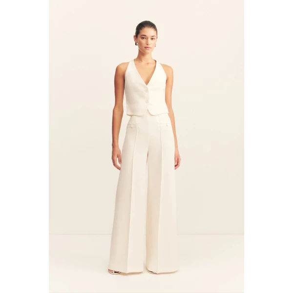 High waisted pant with a wide flare in a textured crepe fabrication.