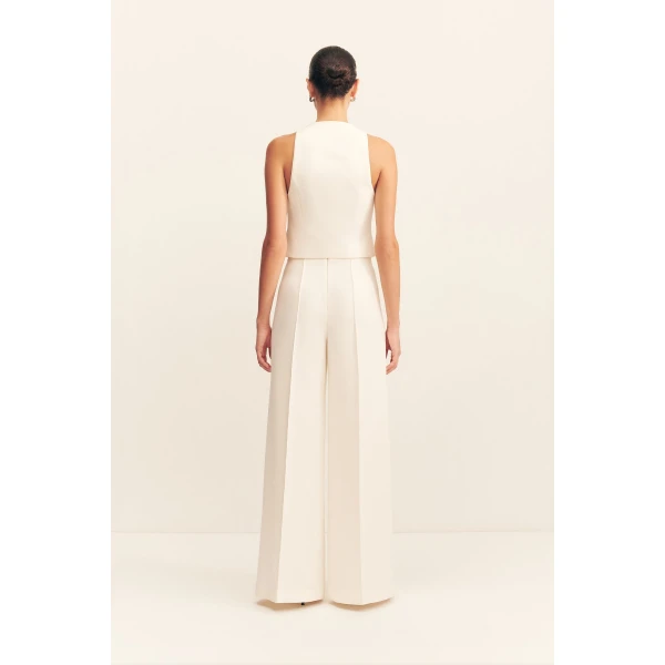 High waisted pant with a wide flare in a textured crepe fabrication.