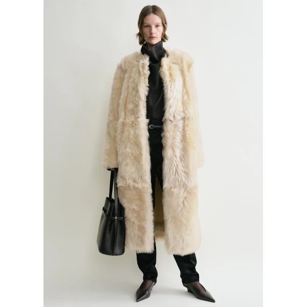 Toteme Coats with minimalist design at Luxury Shoes 