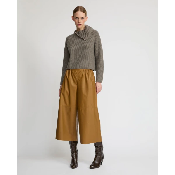 Woman wearing Yves Salomon shearling fur coat – luxury outerwear at Luxury Shoes 