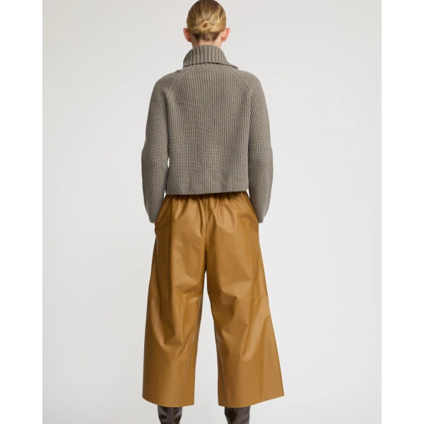 Woman wearing Yves Salomon shearling fur coat – luxury outerwear at Luxury Shoes 