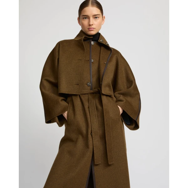 Woman wearing Yves Salomon shearling fur coat – luxury outerwear at Luxury Shoes 