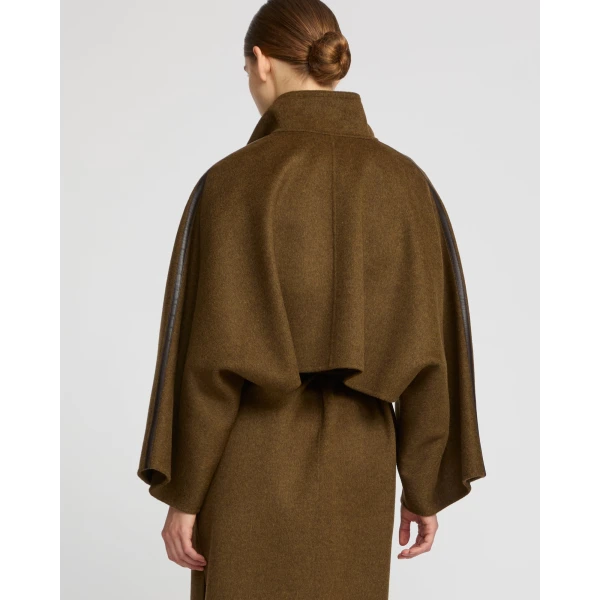 Woman wearing Yves Salomon shearling fur coat – luxury outerwear at Luxury Shoes 