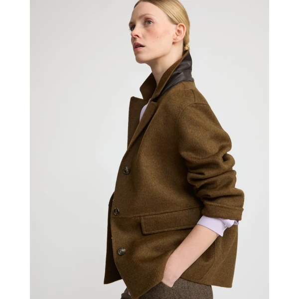 Woman wearing Yves Salomon shearling fur coat – luxury outerwear at Luxury Shoes 
