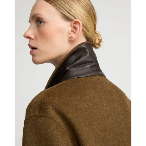 Woman wearing Yves Salomon shearling fur coat – luxury outerwear at Luxury Shoes 