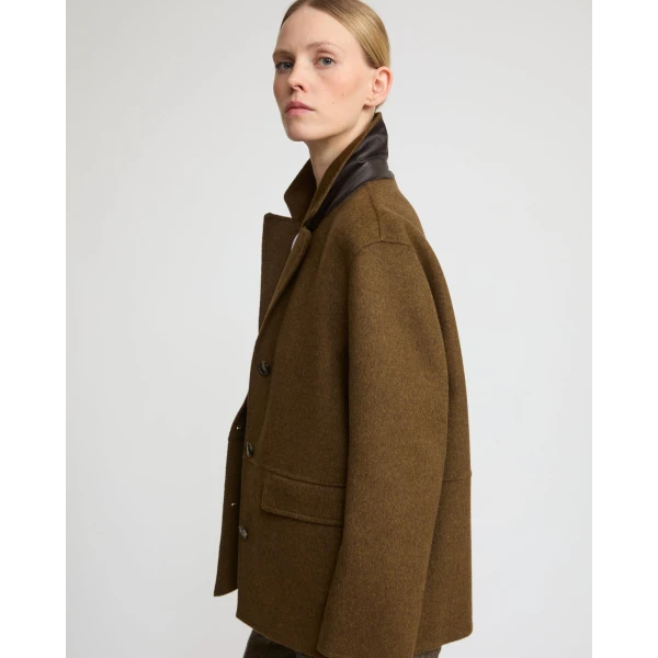 Woman wearing Yves Salomon shearling fur coat – luxury outerwear at Luxury Shoes 