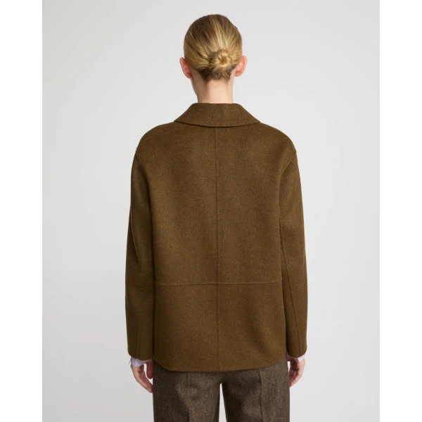Woman wearing Yves Salomon shearling fur coat – luxury outerwear at Luxury Shoes 