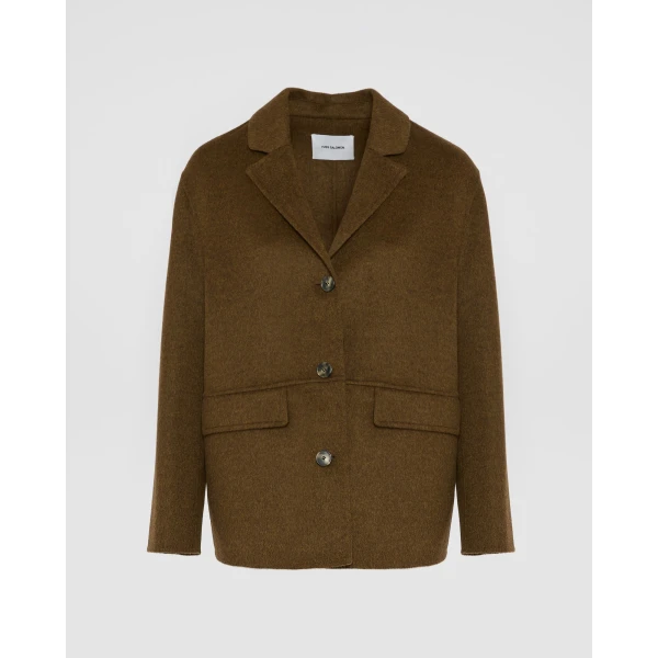 Woman wearing Yves Salomon shearling fur coat – luxury outerwear at Luxury Shoes 