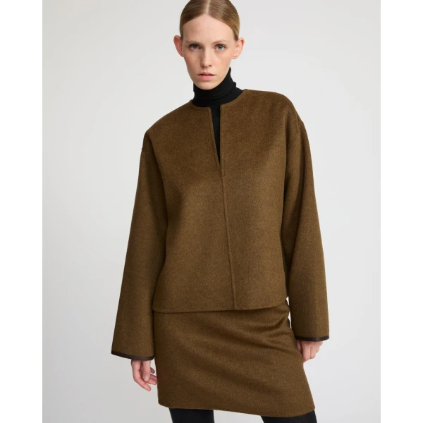 Woman wearing Yves Salomon shearling fur coat – luxury outerwear at Luxury Shoes 