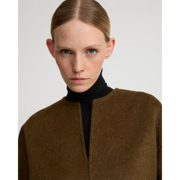 Woman wearing Yves Salomon shearling fur coat – luxury outerwear at Luxury Shoes 
