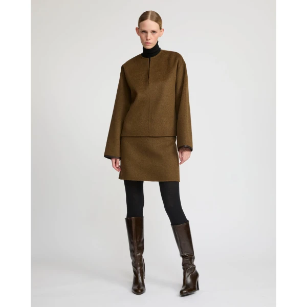 Woman wearing Yves Salomon shearling fur coat – luxury outerwear at Luxury Shoes 