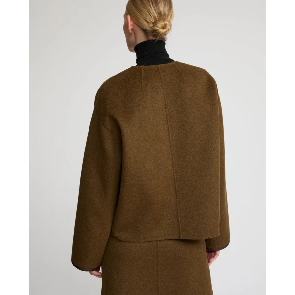 Woman wearing Yves Salomon shearling fur coat – luxury outerwear at Luxury Shoes 