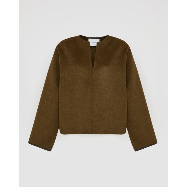 Woman wearing Yves Salomon shearling fur coat – luxury outerwear at Luxury Shoes 