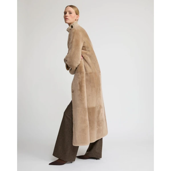 Woman wearing Yves Salomon shearling fur coat – luxury outerwear at Luxury Shoes 