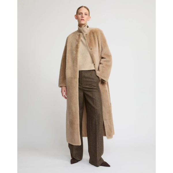 Woman wearing Yves Salomon shearling fur coat – luxury outerwear at Luxury Shoes 
