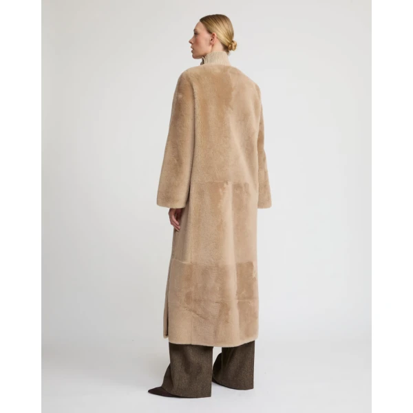 Woman wearing Yves Salomon shearling fur coat – luxury outerwear at Luxury Shoes 