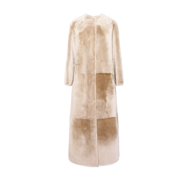 Woman wearing Yves Salomon shearling fur coat – luxury outerwear at Luxury Shoes 