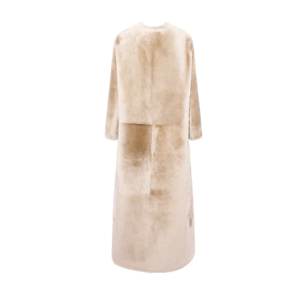Woman wearing Yves Salomon shearling fur coat – luxury outerwear at Luxury Shoes 