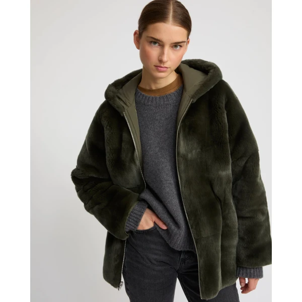 Woman wearing Yves Salomon shearling fur coat – luxury outerwear at Luxury Shoes 
