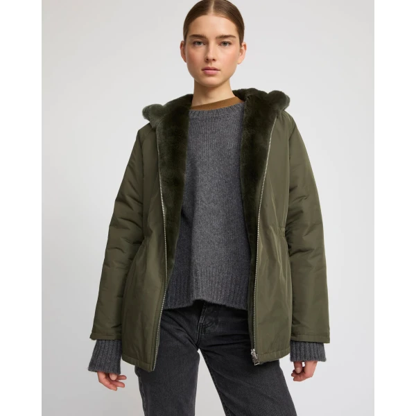 Woman wearing Yves Salomon shearling fur coat – luxury outerwear at Luxury Shoes 
