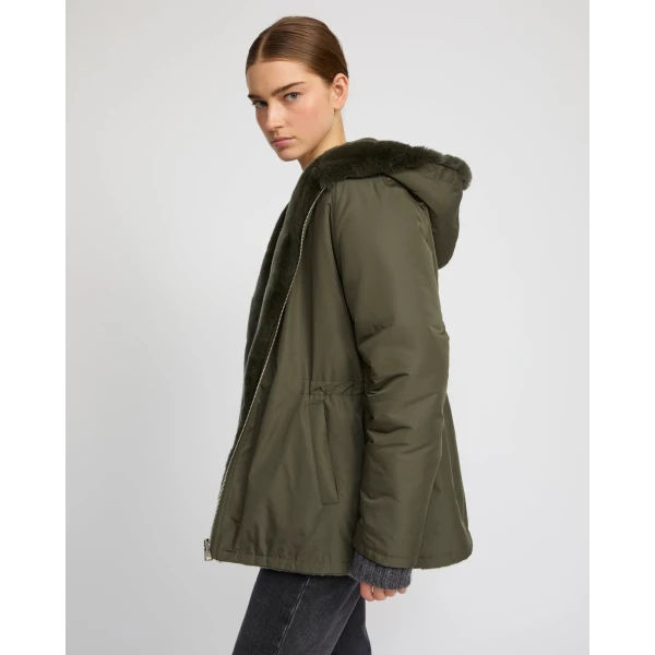 Woman wearing Yves Salomon shearling fur coat – luxury outerwear at Luxury Shoes 