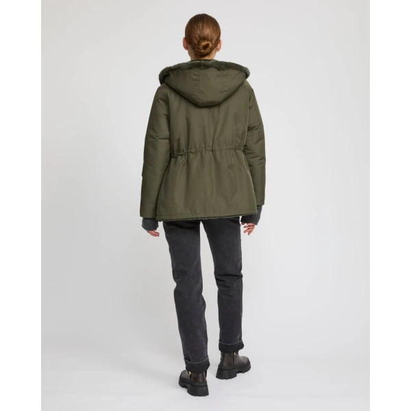 Woman wearing Yves Salomon shearling fur coat – luxury outerwear at Luxury Shoes 