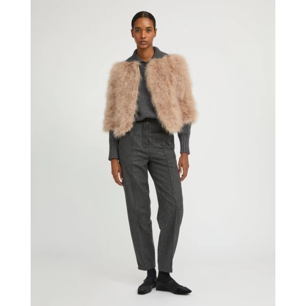 Woman wearing Yves Salomon shearling fur coat – luxury outerwear at Luxury Shoes 