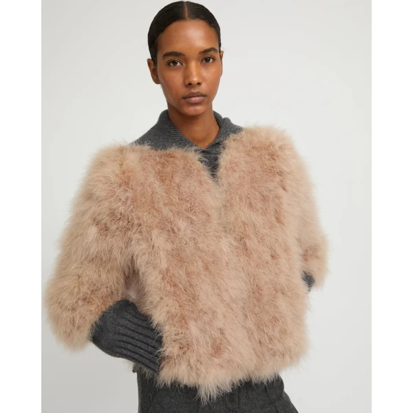 Woman wearing Yves Salomon shearling fur coat – luxury outerwear at Luxury Shoes 