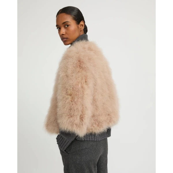 Woman wearing Yves Salomon shearling fur coat – luxury outerwear at Luxury Shoes 