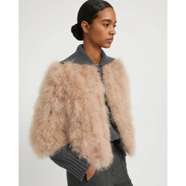 Woman wearing Yves Salomon shearling fur coat – luxury outerwear at Luxury Shoes 