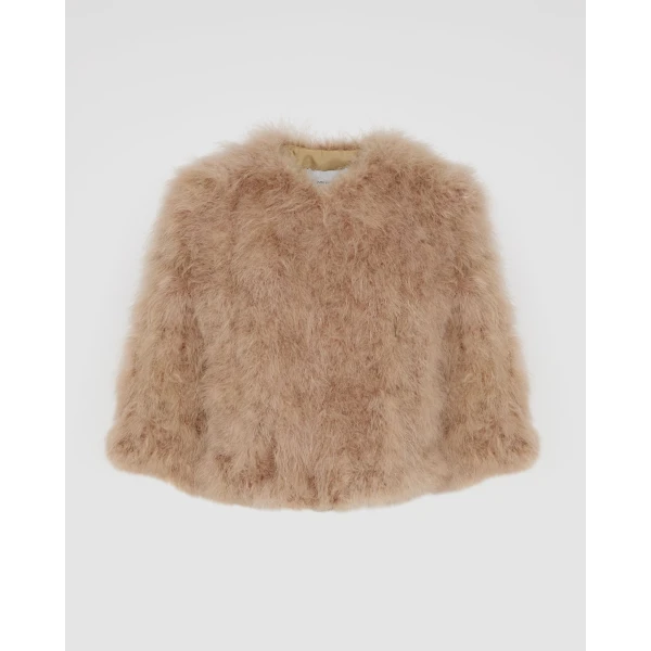 Woman wearing Yves Salomon shearling fur coat – luxury outerwear at Luxury Shoes 