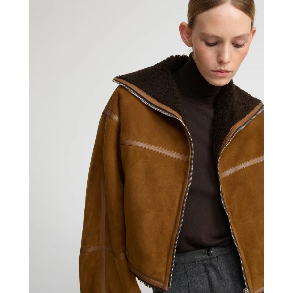 Woman wearing Yves Salomon shearling fur coat – luxury outerwear at Luxury Shoes 