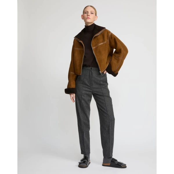 Woman wearing Yves Salomon shearling fur coat – luxury outerwear at Luxury Shoes 