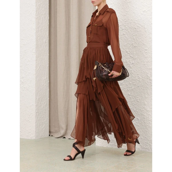 Elevate your elegance in this Zimmermann Tops   from the 2025 resort wear edit
