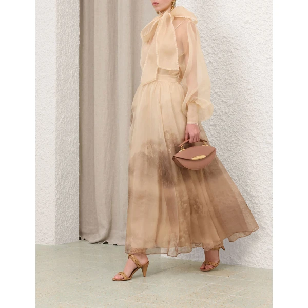 Elevate your elegance in this Zimmermann Tops   from the 2025 resort wear edit