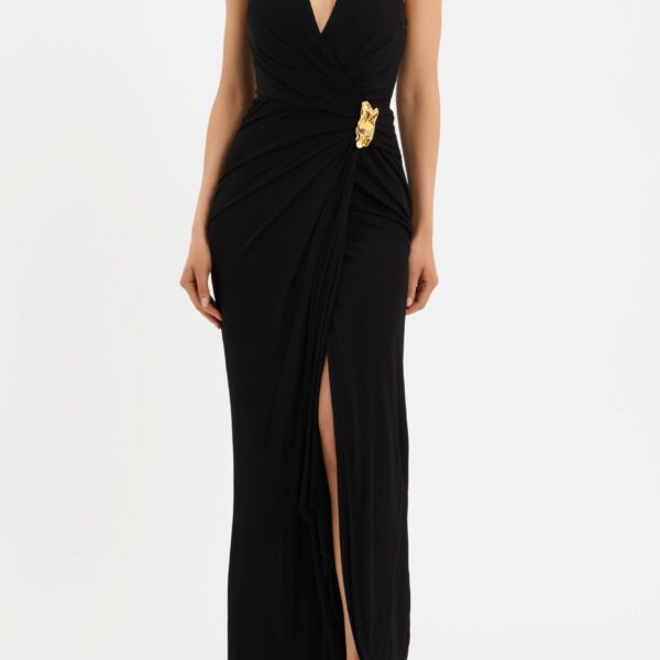 designed to make a statement. Defined by a halter V-neckline