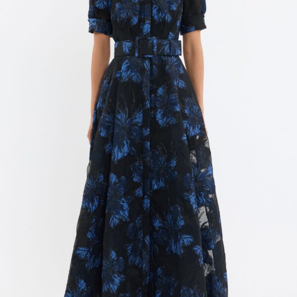 crafted from metallic brocade in striking hues of blue and black. Featuring a collared neckline and short puff sleeves with cuffed detailing