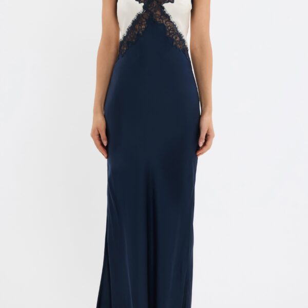 featuring intricate lace applique panels. Its bias-cut silhouette drapes elegantly to flatter the feminine figure