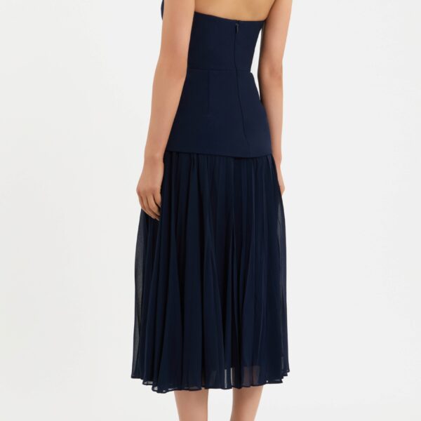while the pleated midi skirt underlay enhances the elegant shape. Lined and completed with a back zip fastening