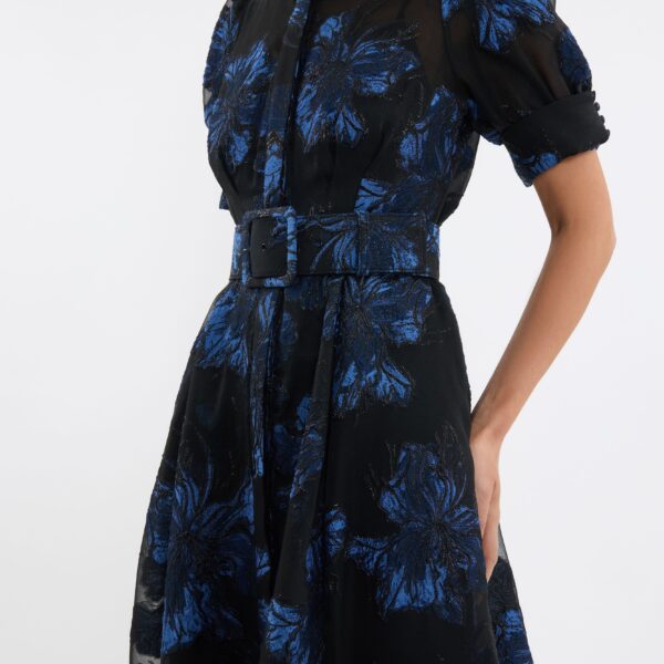 this gown includes a slip dress with adjustable straps for versatile styling.